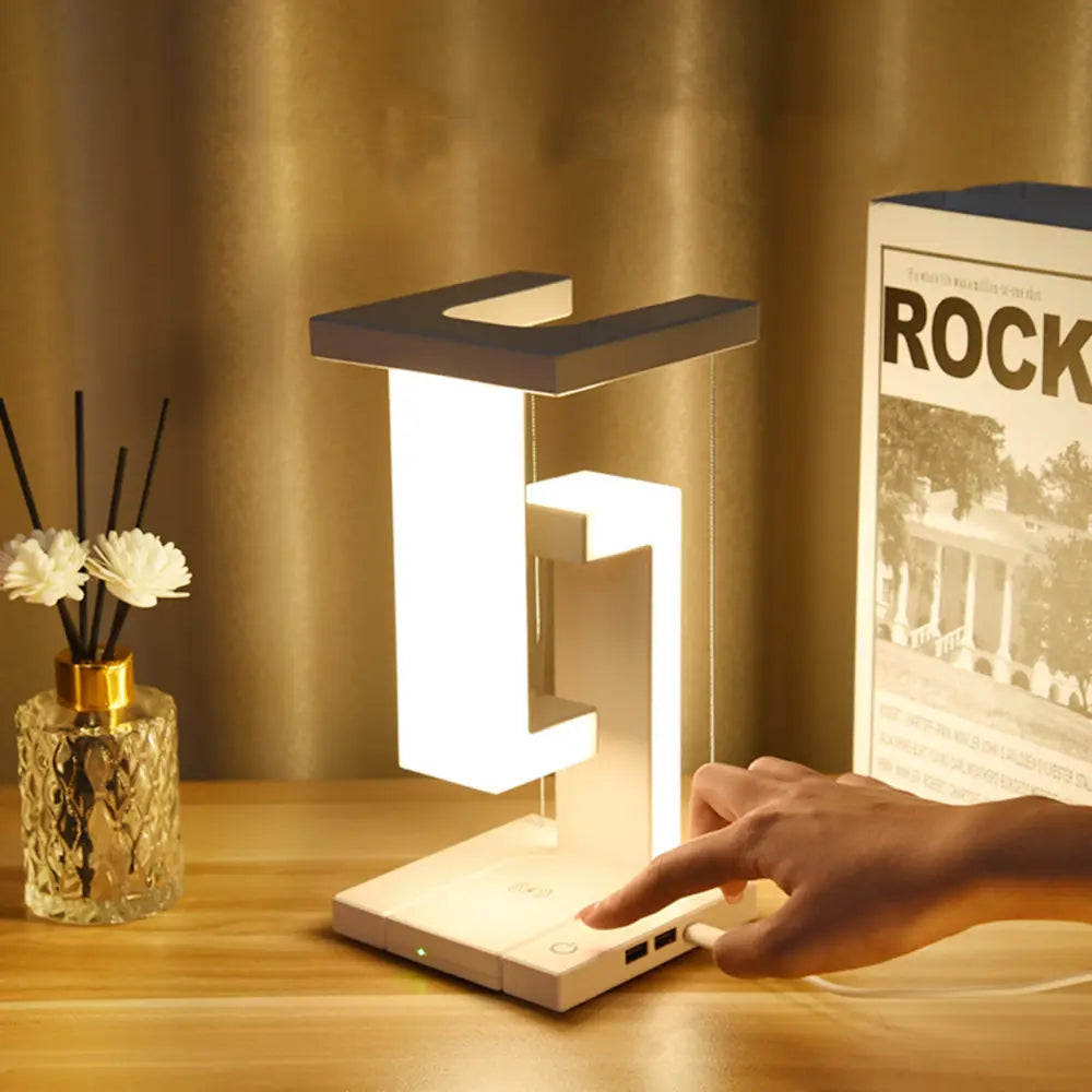Lampe de table moderne avec design tensegrity flottant et station de charge sans fil