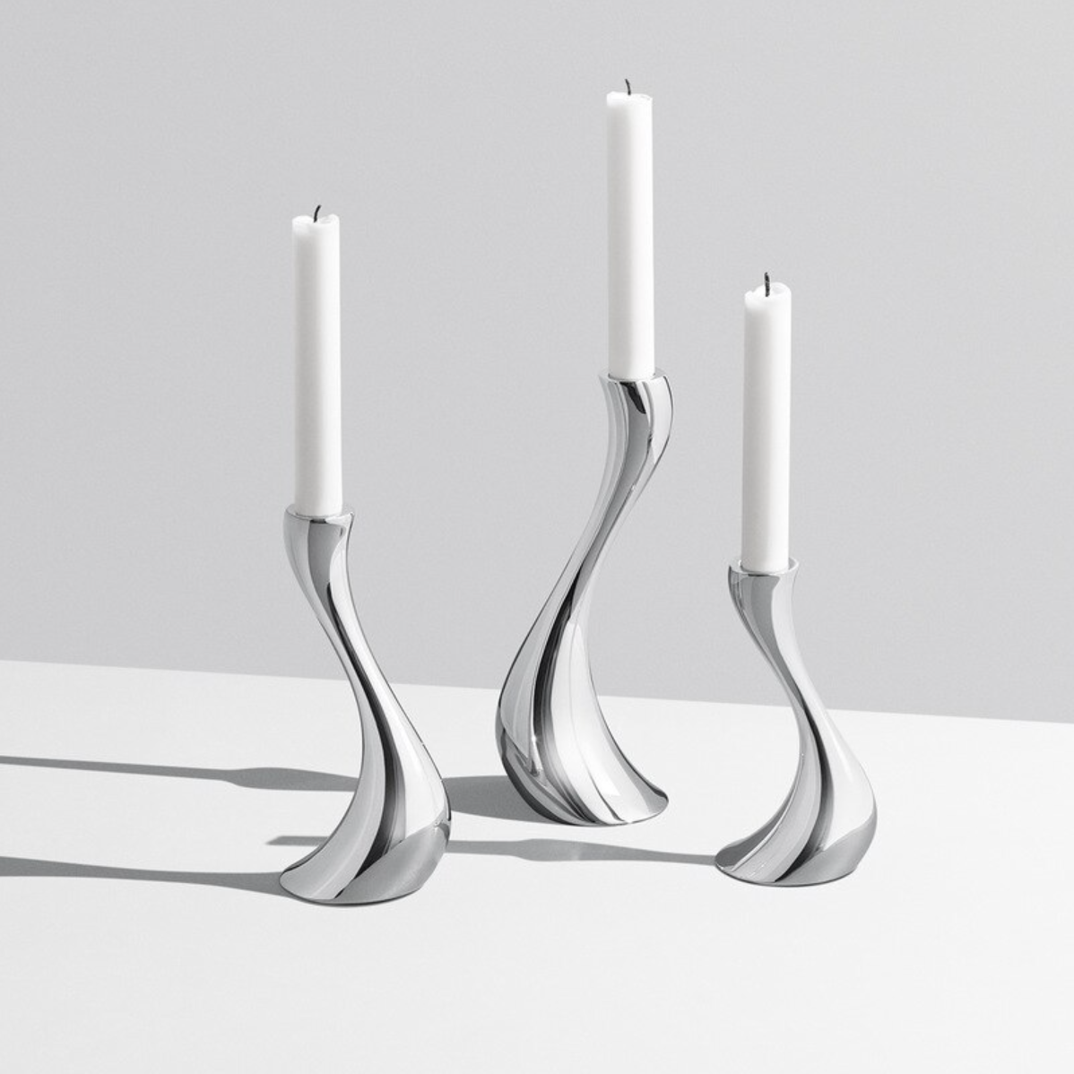 LumaWave – Luxe Chrome Candle Holders with Elegant Wave Shape