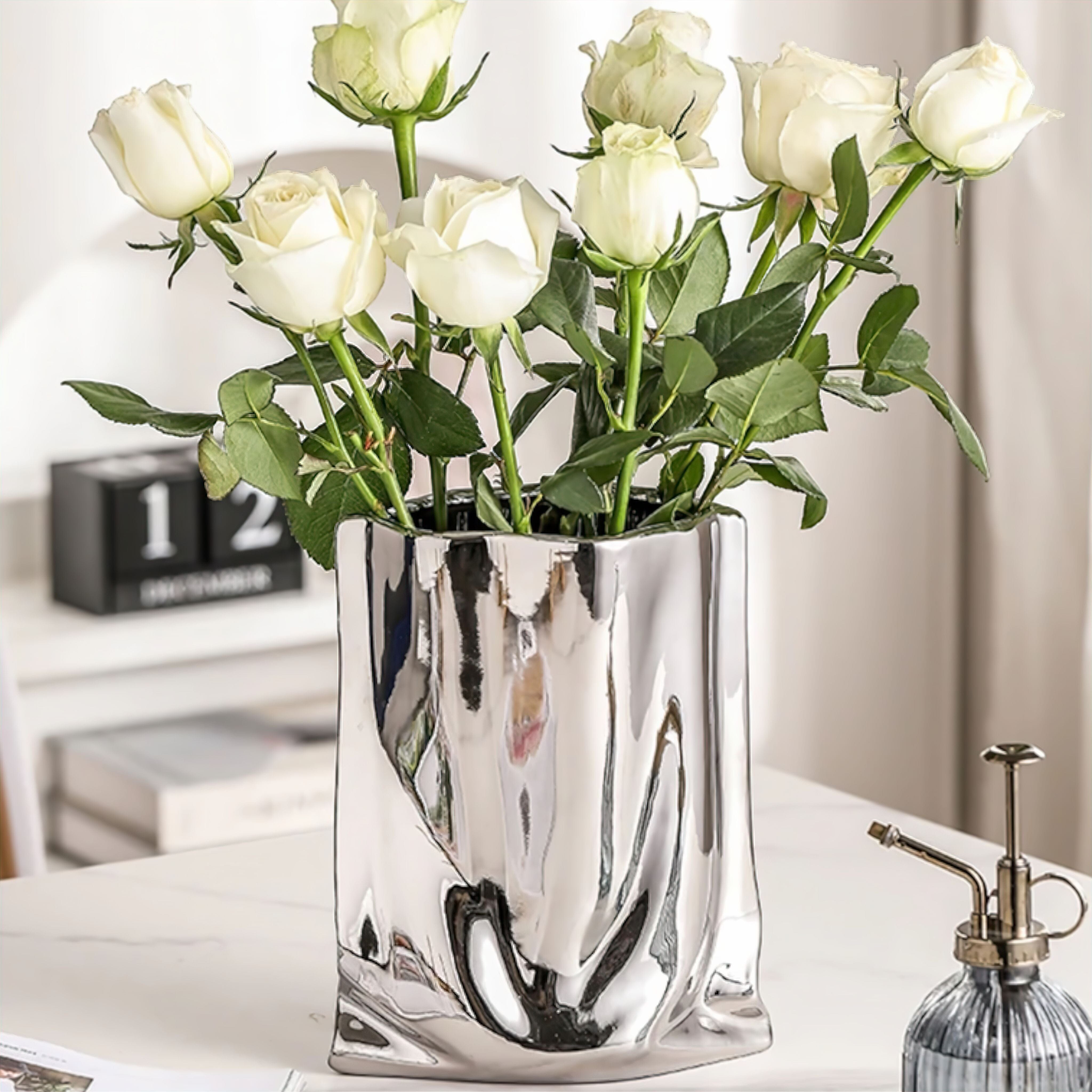 Silver Ceramic Sculpture Vase with Flowing Design and Reflective Chrome