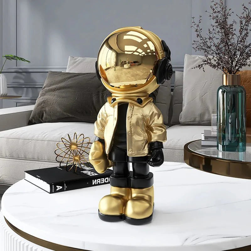 CosmoLuxe – Elegant Astronaut Statue with Gold Accents