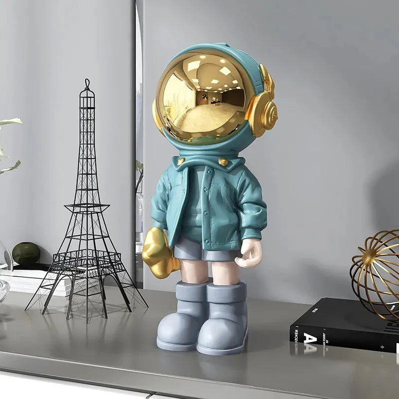 CosmoLuxe – Elegant Astronaut Statue with Gold Accents