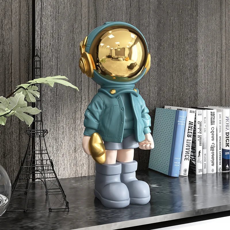 CosmoLuxe – Elegant Astronaut Statue with Gold Accents