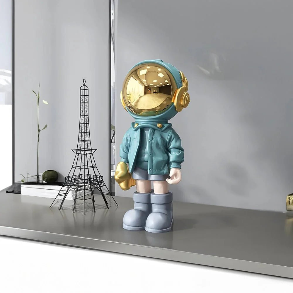 CosmoLuxe – Elegant Astronaut Statue with Gold Accents